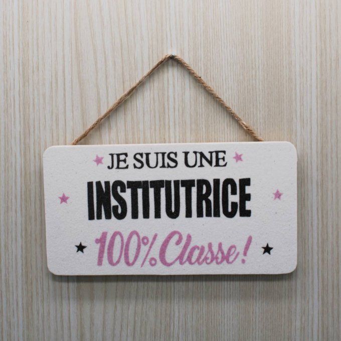 Plaque de porte Institutrice 100% classe en sable noir et rose