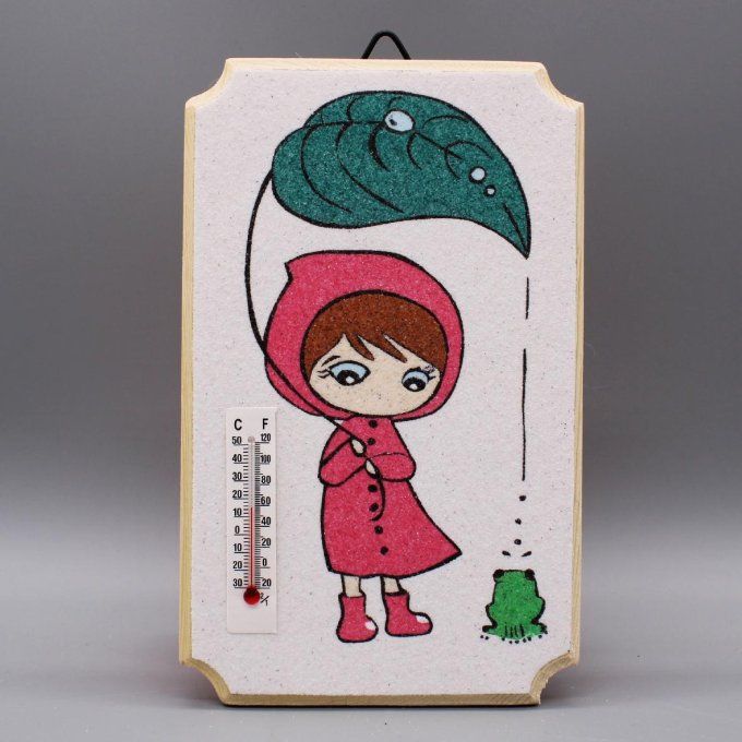 Thermomètre "La petite fille et la grenouille" illustrant une petite fille et une grenouille